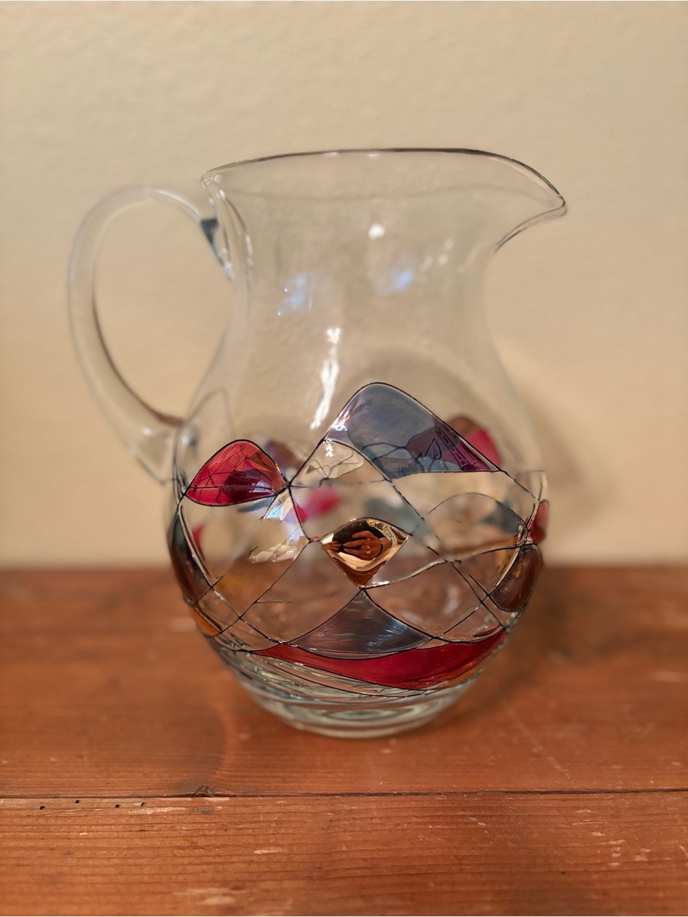 Decorative Glass Pitcher with Red and Blue Wave Accents